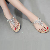 Flache Flip Flops mit Strasssteinen