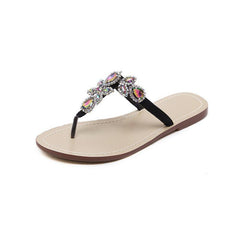 Flache Flip Flops mit Strasssteinen