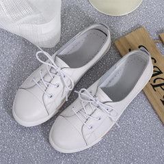 Zapatos planos de piel auténtica con cordones