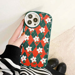 Funda para iPhone con diseño de margaritas y rombos