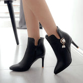 Stiefeletten mit hohem Absatz und dekorativer Blume