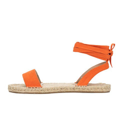 Sandalias planas romanas con tiras cruzadas