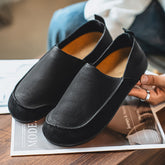 Flat slip-on Birkenstock-style loafers—stylish and casual.