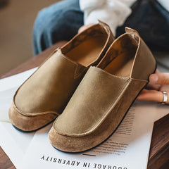 Flat slip-on Birkenstock-style loafers—stylish and casual.
