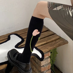 Schwarze Kniestrümpfe mit Tulpenmotiv