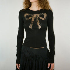 Top de encaje transparente con lazo Coquette