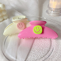 Garra para el cabello con cara sonriente