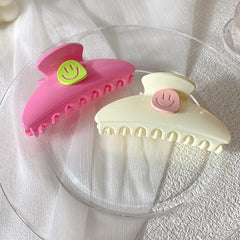 Garra para el cabello con cara sonriente