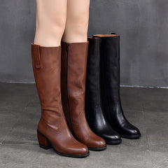 Botas largas clásicas de cuero con cremallera lateral y tacón alto