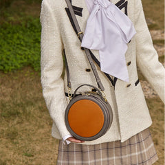 Mini bolso circular retro de piel de vacuno curtida vegetal