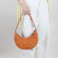 Unterarmtasche aus pflanzlich gegerbtem Leder mit Gitterdesign