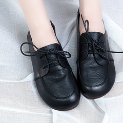 Oxfords planos suaves con cordones