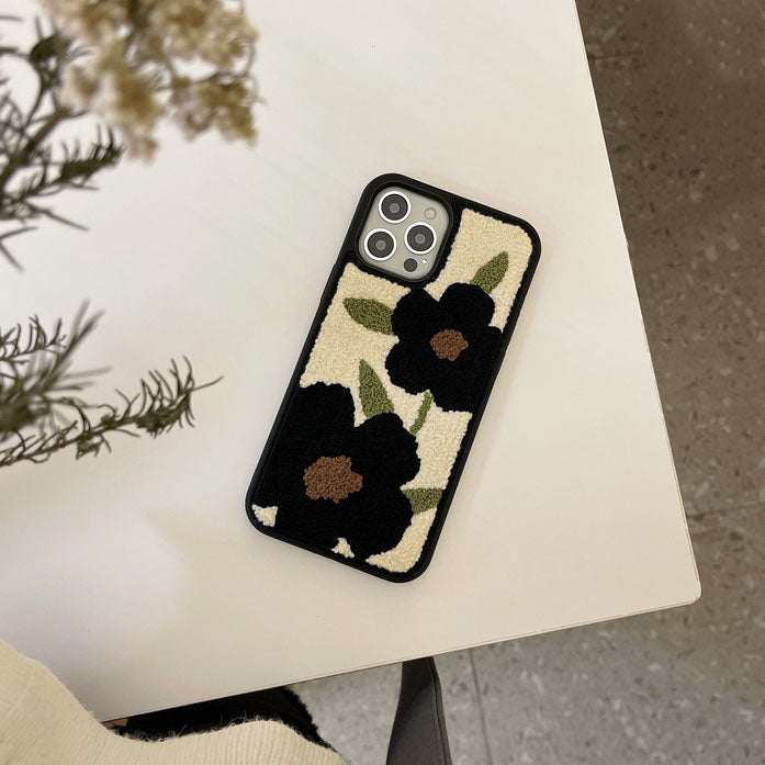 Funda para iPhone con diseño de osito de peluche y flores negras