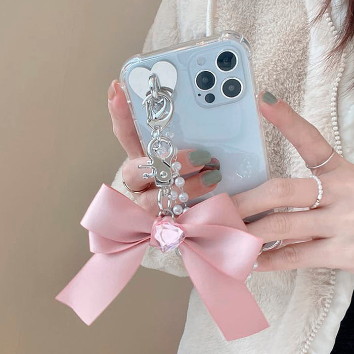 Funda para iPhone con cadena de perlas y lazo