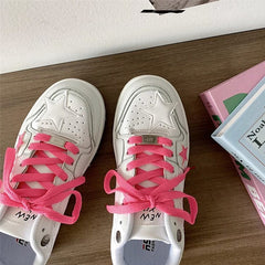 Zapatillas deportivas con estrellas en color rosa chicle y blanco