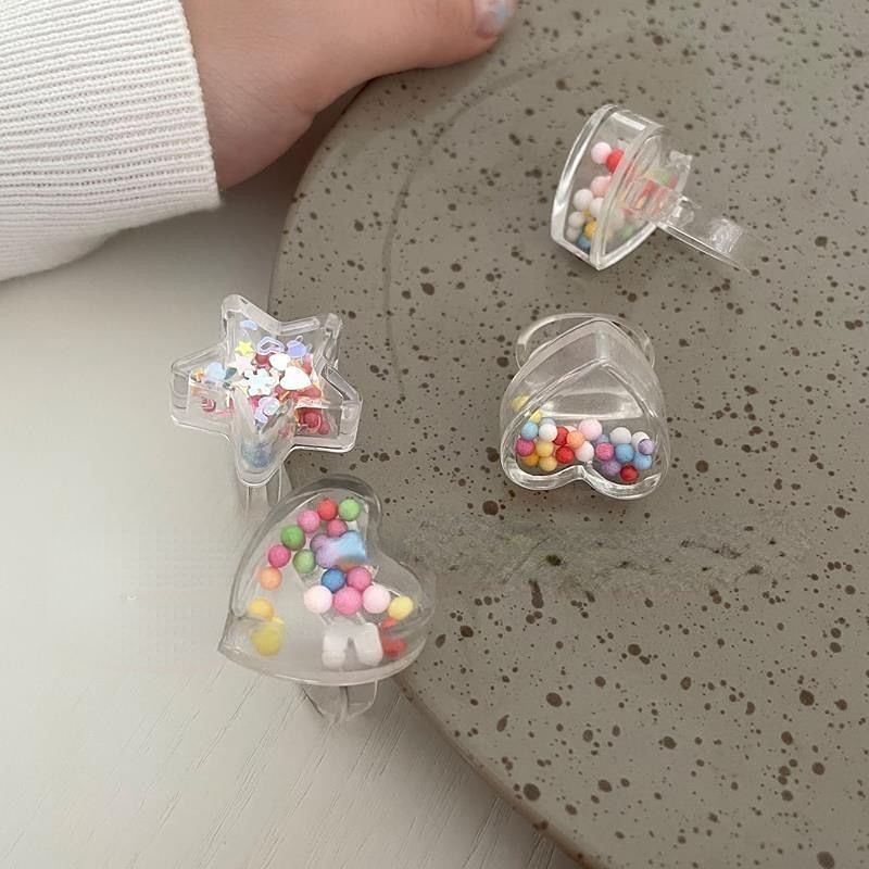 Anillos transparentes con cuentas de caramelo