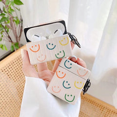 Estuche para AirPods con caras sonrientes de colores