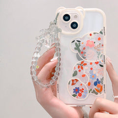 Funda para iPhone con cadena de oso floral