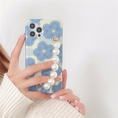 Funda para iPhone con cadena de perlas y flores 