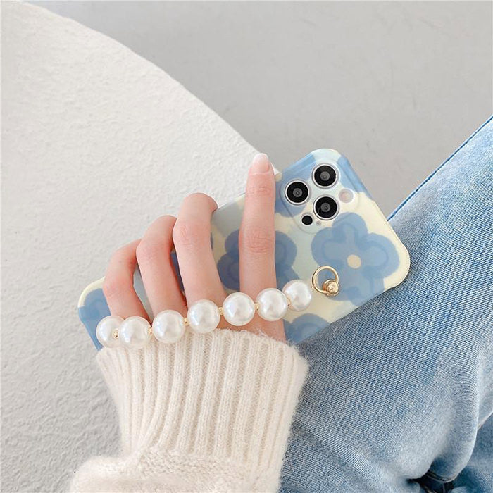 Funda para iPhone con cadena de perlas y flores 