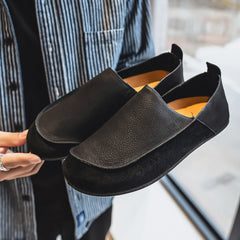 Flat slip-on Birkenstock-style loafers—stylish and casual.