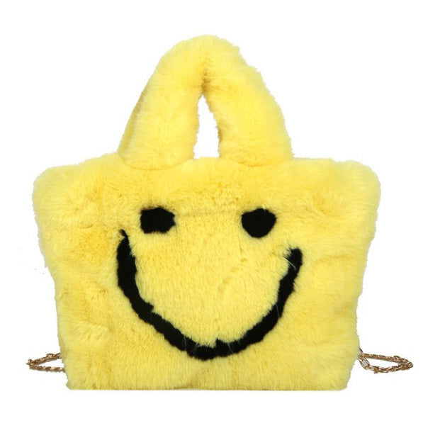 Bolso peludo con cara sonriente