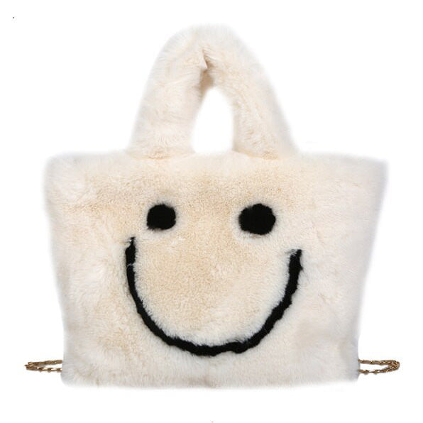 Bolso peludo con cara sonriente