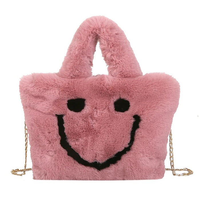 Bolso peludo con cara sonriente