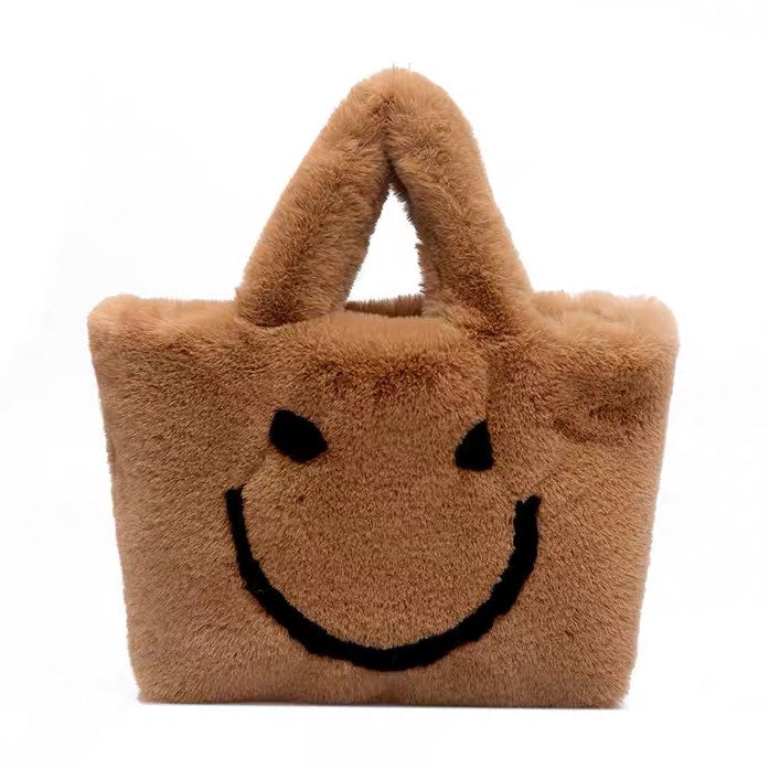 Bolso peludo con cara sonriente