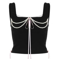 Top bustier con lazo y perlas Coquette