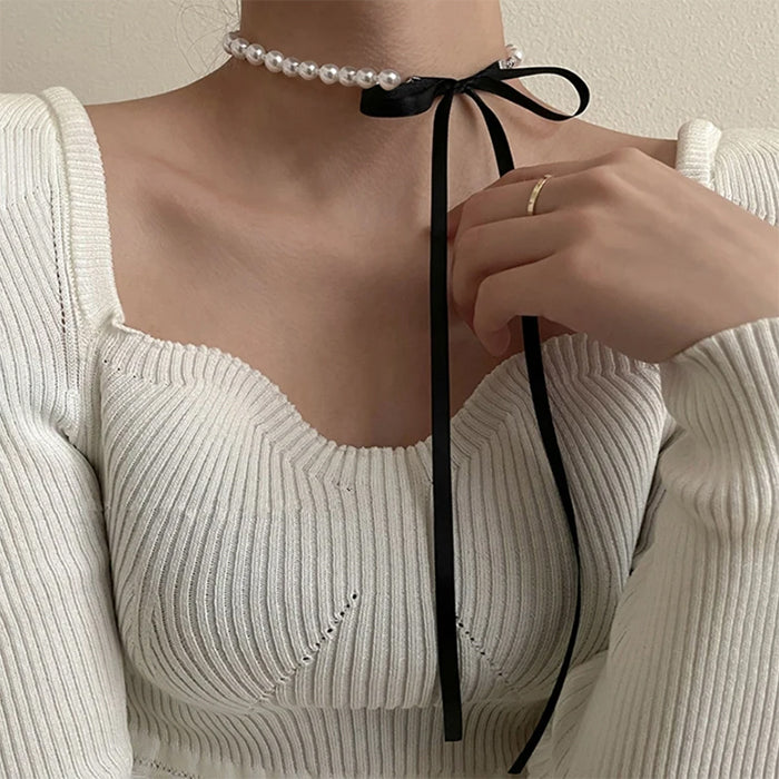 Collar de perlas con lazo coqueto