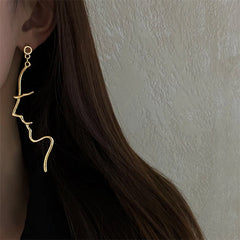 Pendientes minimalistas con contorno de rostro