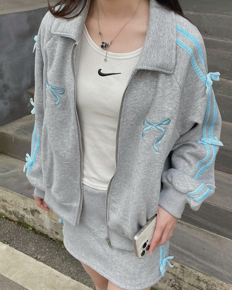 Chaqueta deportiva con rayas laterales y lazos Coquette