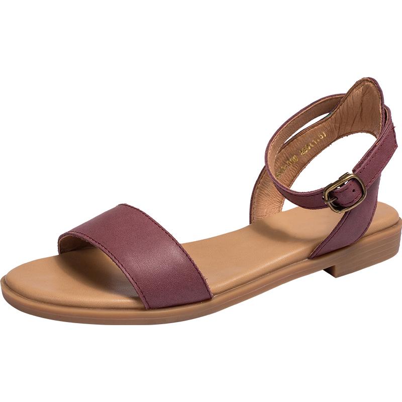 Sandalias Donddi hechas a mano en amarillo, negro, morado y marrón.