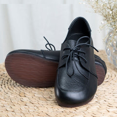 Oxfords planos suaves con cordones